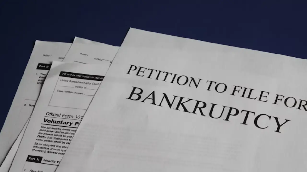Bankruptcy lawyer discussing case with client in office